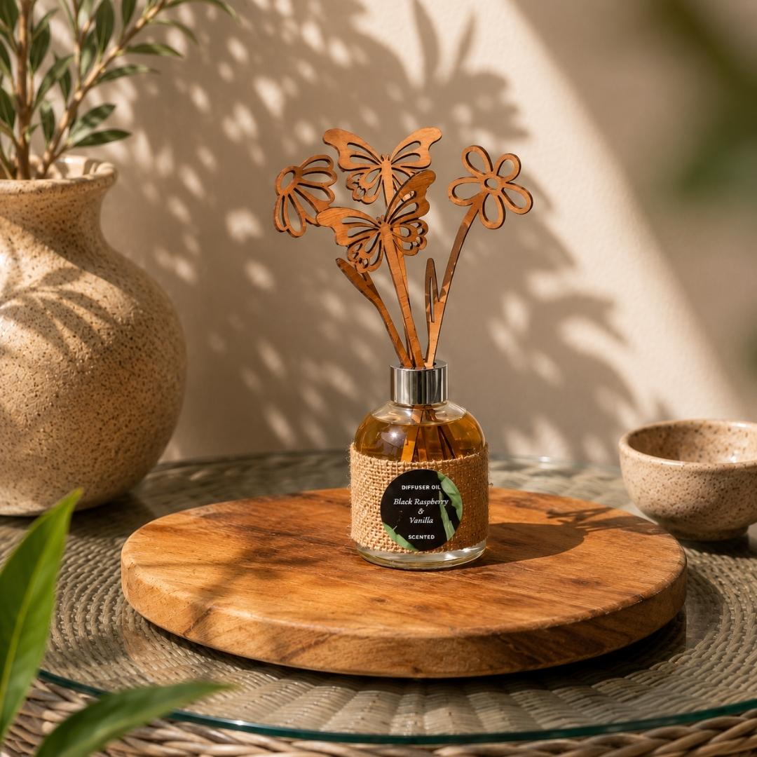 Decorative diffuser with butterfly design on a wooden stand, surrounded by plants.